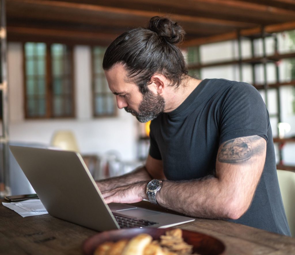 Man at home on laptop