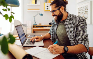 man at computer researching