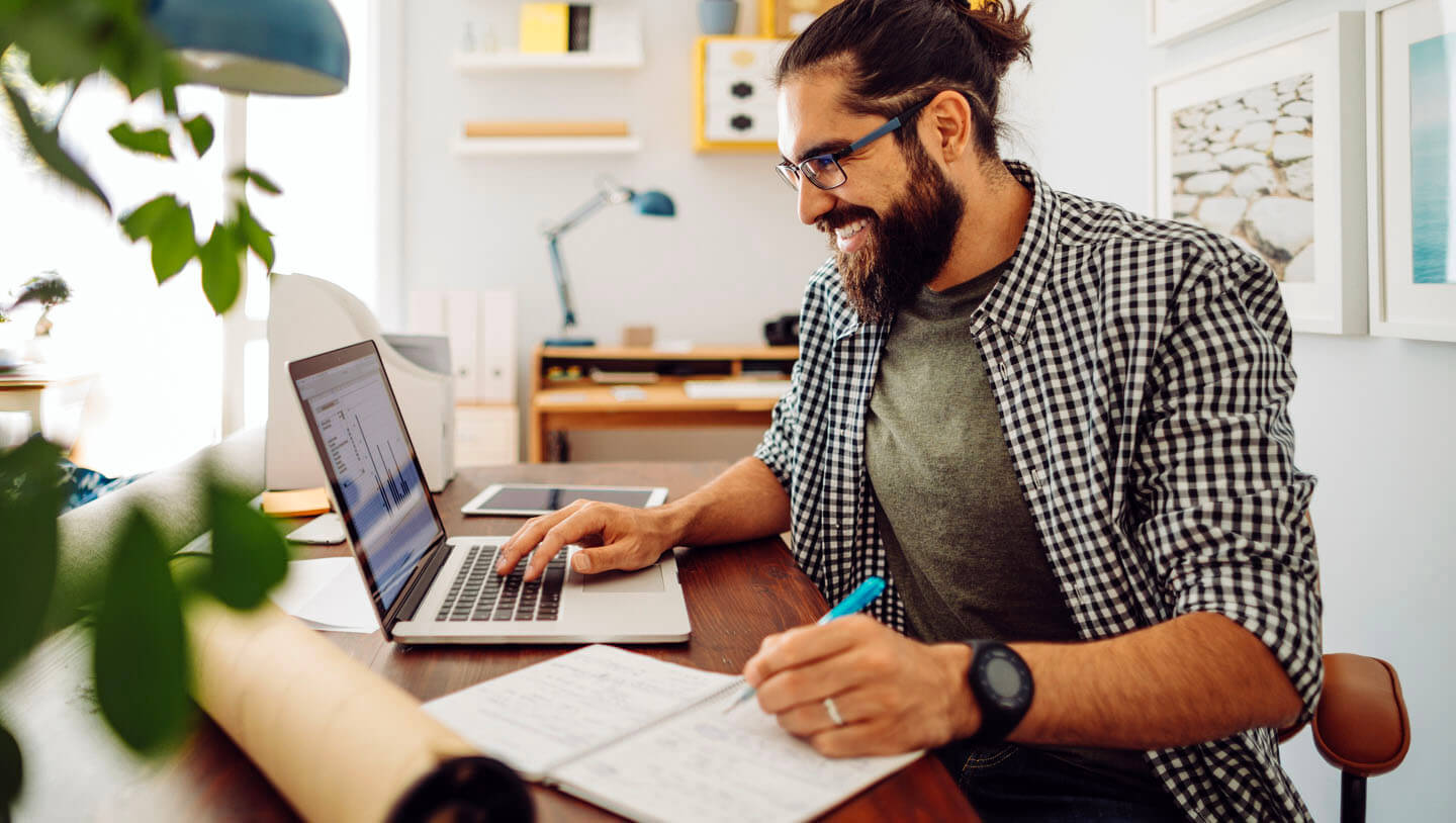 man at computer researching