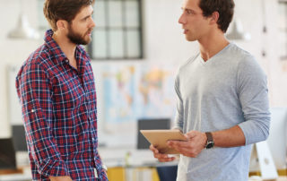 Two home inspectors discussing marketing tips for home inspection business