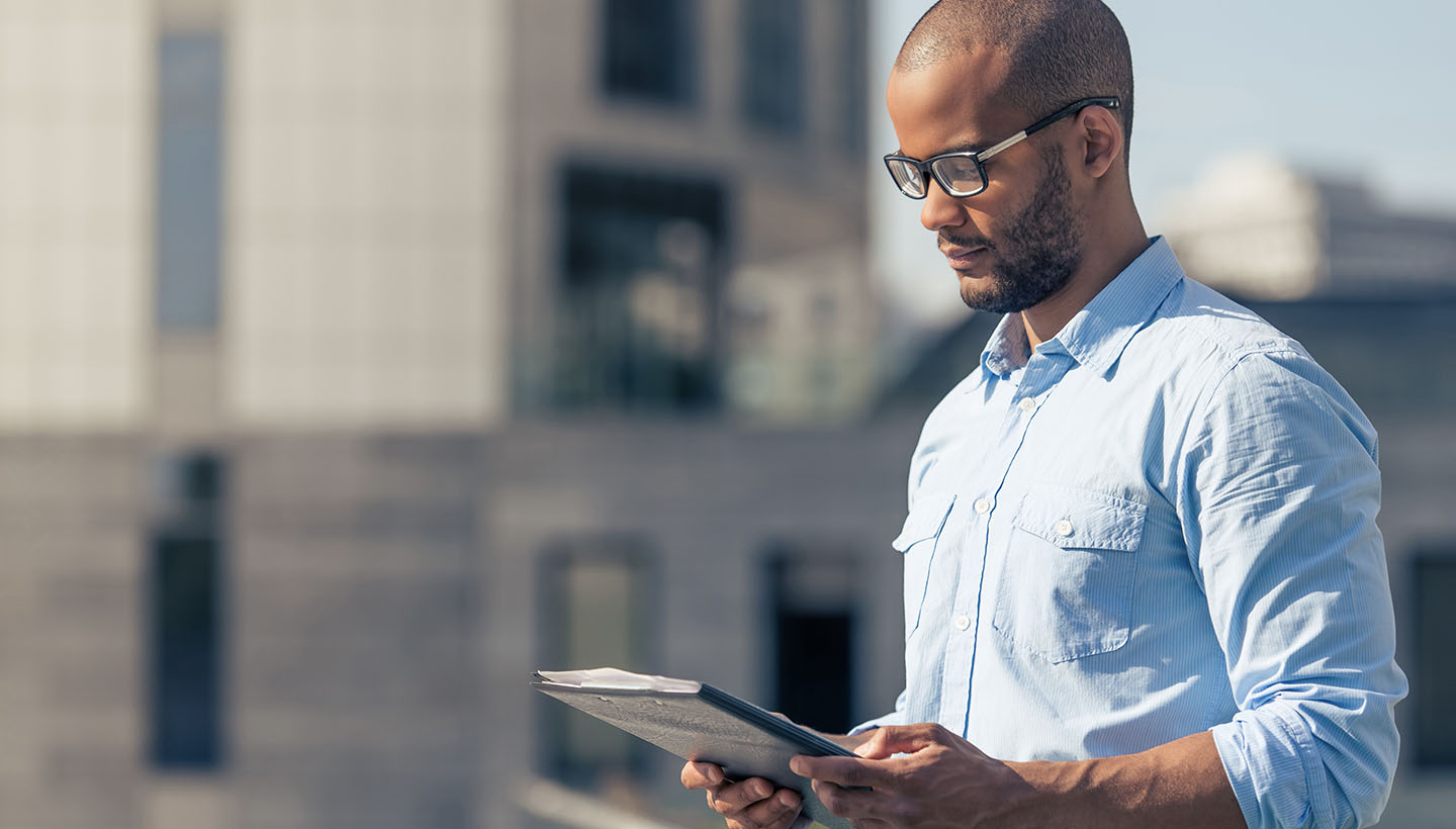 A Certified Commercial Property Inspector completing an inspection report