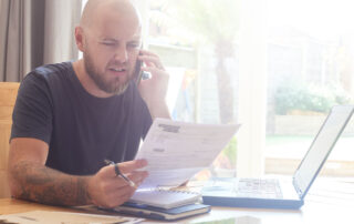 A home inspector reviewing an inspection report with a client via phone