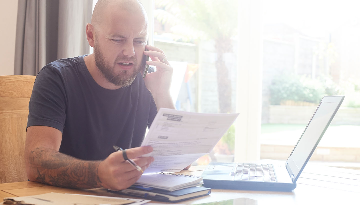 A home inspector reviewing an inspection report with a client via phone