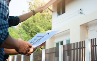 Home insurance inspections: What you need to know. Here's an inspector and a client reviewing notes