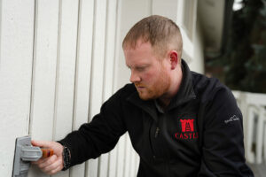 Photo of home inspector Phil Stokke inspection an electrical outlet